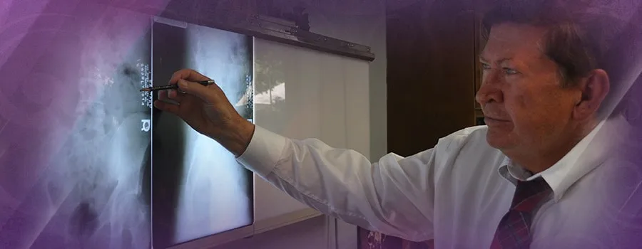 Dr. Daniel Reida pointing out a finding on a spinal x-ray